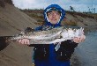A picture in which I hold a seabass of 81 cm in length and 3.7 Kg in weight.